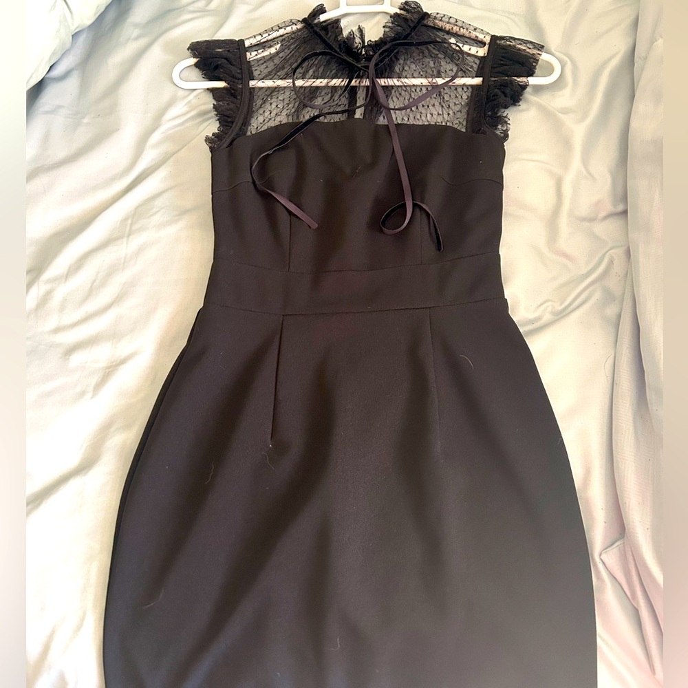A black Zapaka cocktail dress the straps are lace with zip up  knee length